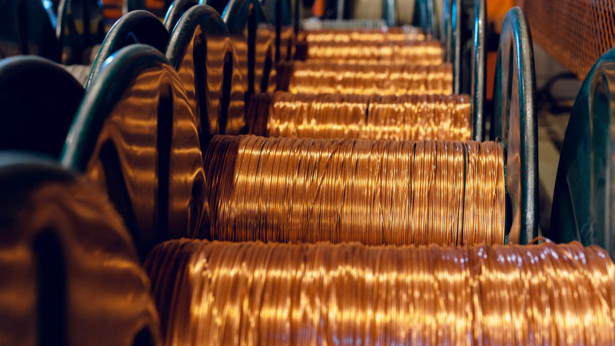 Production of copper wire cable in reels at factory Cable factory Close up - Caravel Minerals Limited